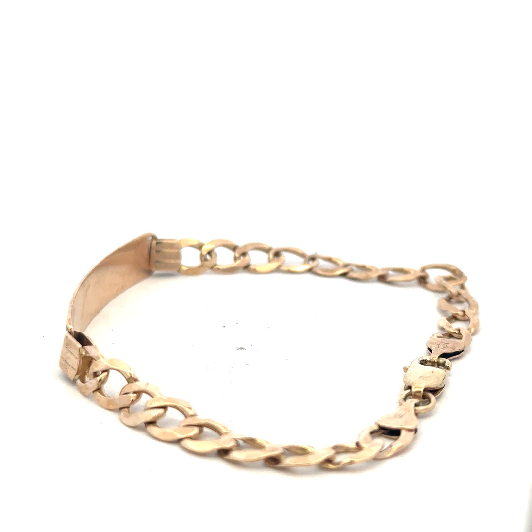 9ct yellow gold ID bracelet weighing 9.7g with a classic design, featuring a polished finish and an adjustable chain.