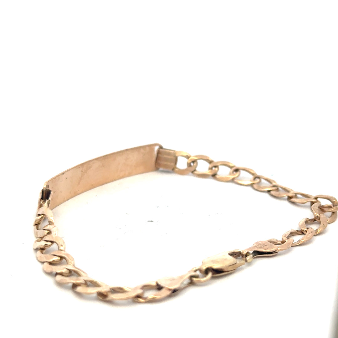 9ct yellow gold ID bracelet with a sleek design and secure clasp, weighing 9.7 grams, unbranded jewelry piece.