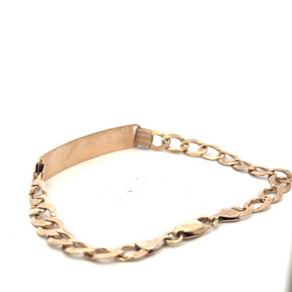 9ct yellow gold ID bracelet with a sleek design and secure clasp, weighing 9.7 grams, unbranded jewelry piece.