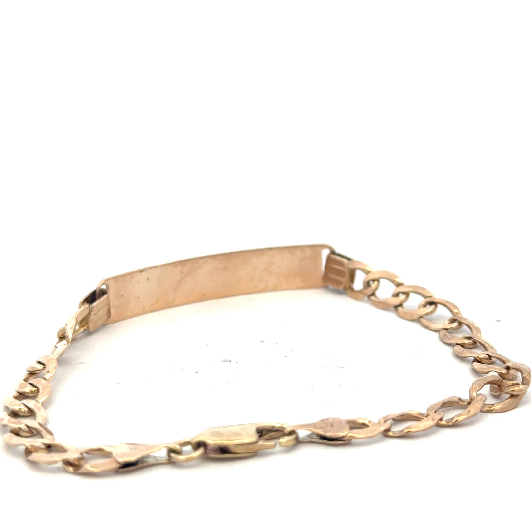 9ct yellow gold ID bracelet weighing 9.7g, featuring a sleek design and secure clasp, unbranded jewelry accessory.
