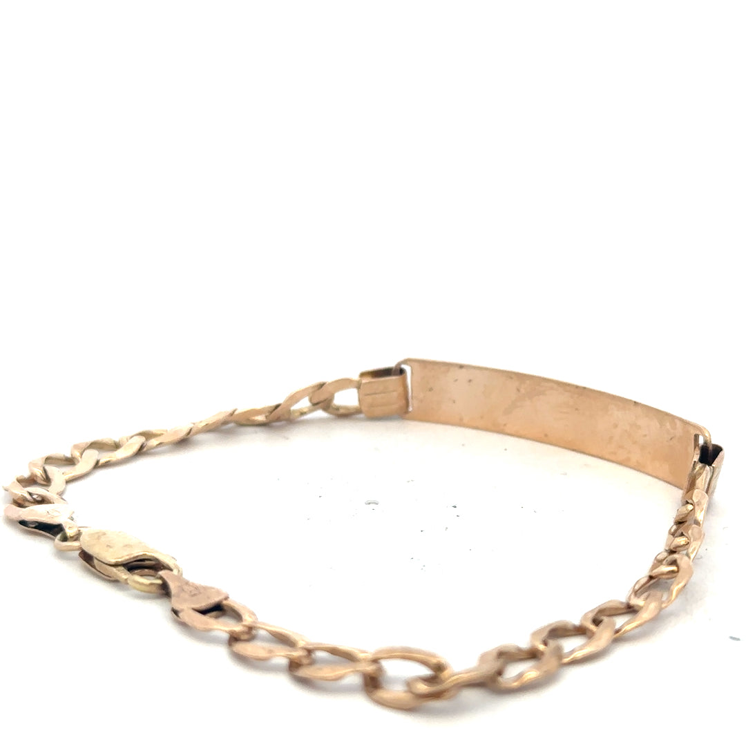 9ct yellow gold ID bracelet weighing 9.7g, unbranded, with a polished finish and engraved ID plate, visible chain links in the image.