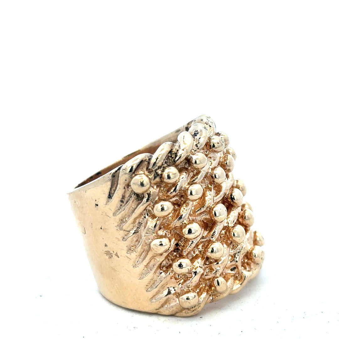 9ct yellow gold keeper ring, unbranded, showcasing a smooth band with a secure clasp, weighs 61.1 grams.
