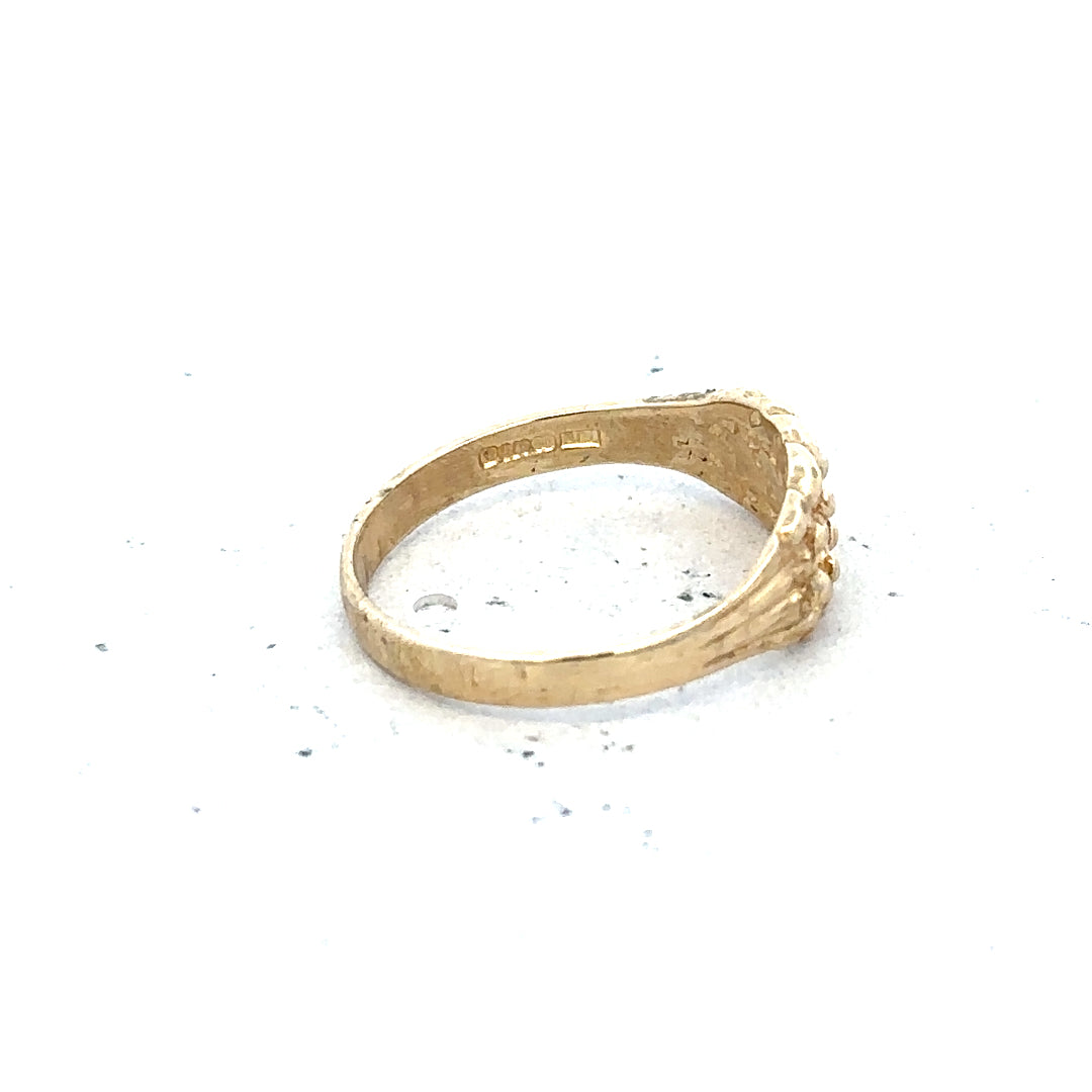 9ct yellow gold keeper ring in size H, unbranded, featuring a simple band design visible in the image.