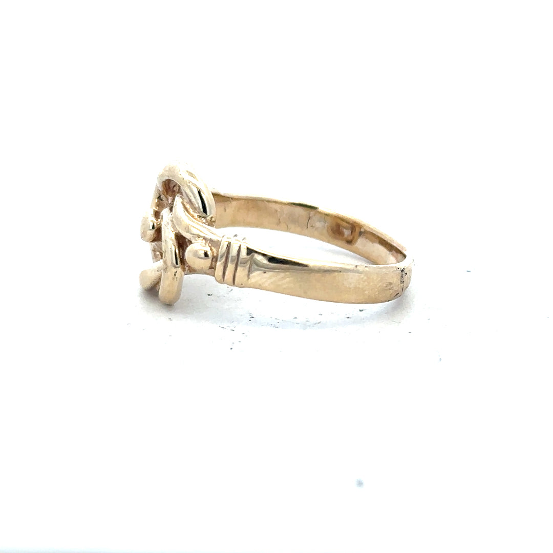 9ct yellow gold knot ring in size Z1 with a polished finish, showcasing an elegant intertwined design.