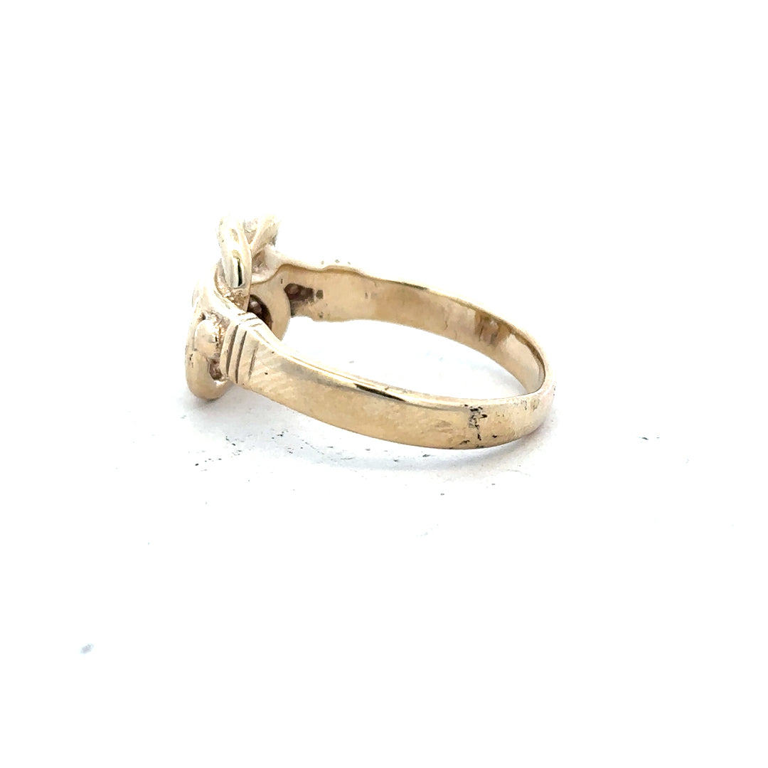 9ct yellow gold knot ring in size Z1, featuring a polished gold band and intricate knot design.