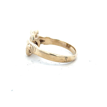 9ct yellow gold knot ring in size Z1, featuring a polished gold band and intricate knot design.