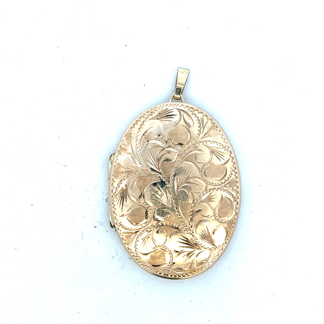 9ct yellow gold locket pendant showing intricate design and polished surface, weighing 13.8 grams, unbranded jewelry accessory.
