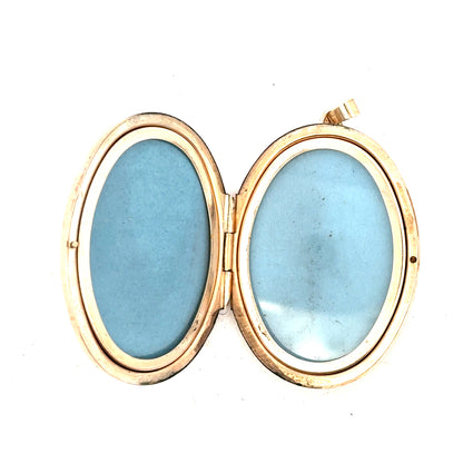 9ct yellow gold locket pendant weighing 13.8g, featuring a classic design, unbranded jewelry accessory.