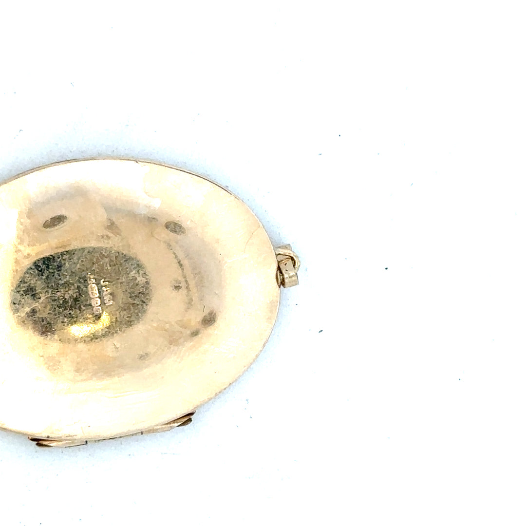 9ct yellow gold locket pendant with intricate design, weighing 13.8g, unbranded jewelry accessory showcasing a polished finish.