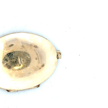 9ct yellow gold locket pendant with intricate design, weighing 13.8g, unbranded jewelry accessory showcasing a polished finish.
