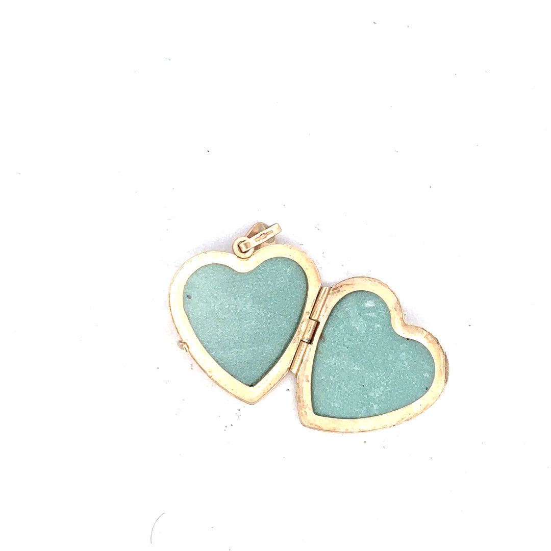 9ct yellow gold locket pendant weighing 2.5g, classic jewelry piece with a smooth polished surface and detailed clasp.