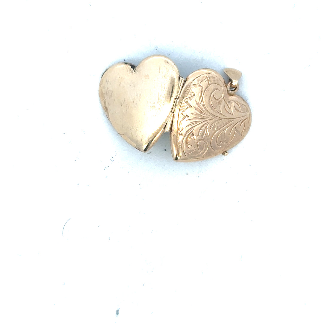 9ct yellow gold locket pendant, unbranded, weighing 2.5g, featuring a classic design with a smooth polished finish.
