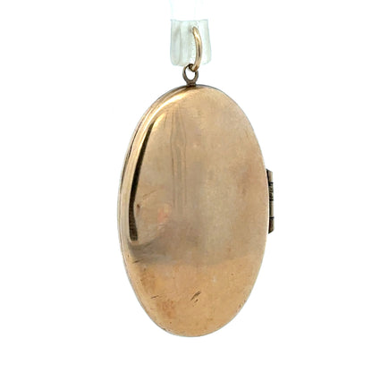 Yellow gold locket pendant, 9ct gold, weighs 5.8g, unbranded, featuring a classic design with a polished finish.