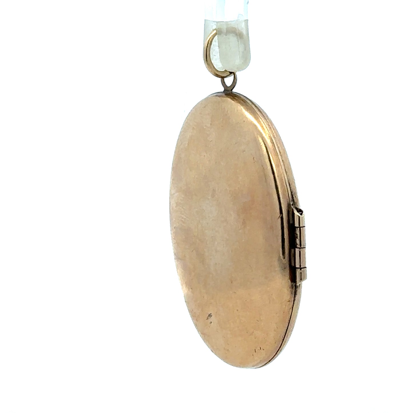 9ct yellow gold locket pendant weighing 5.8g, unbranded, with intricate design visible in the image.
