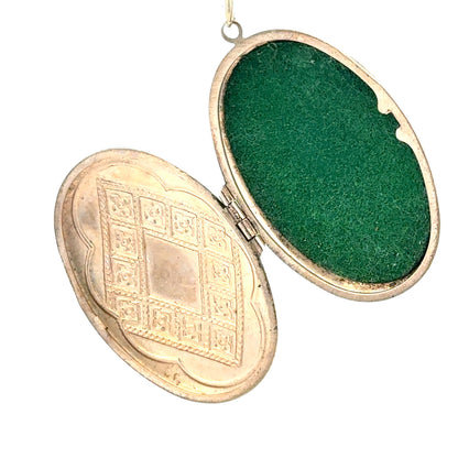 9ct yellow gold locket pendant, unbranded, 5.8g, close-up showing intricate design and polished finish.