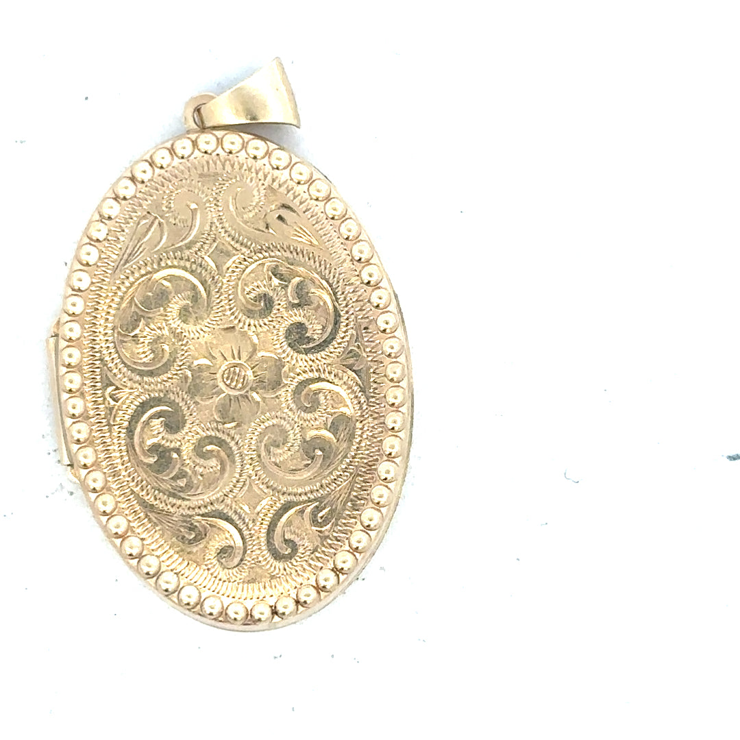 9ct yellow gold locket pendant with intricate design, weighs 6.3g, featuring a classic, elegant style.
