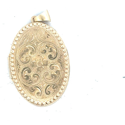 9ct yellow gold locket pendant with intricate design, weighs 6.3g, featuring a classic, elegant style.