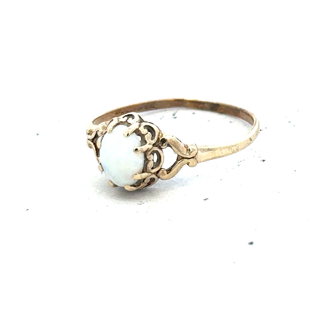9ct yellow gold opal ring in size P with a vibrant, iridescent opal gemstone, elegant and handcrafted jewelry piece.