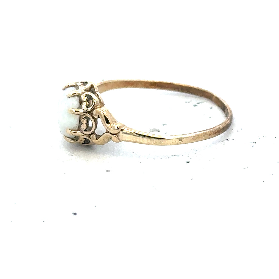 9ct yellow gold opal ring in size P with vibrant multicolored opal gemstone and gold band, unbranded jewelry accessory.