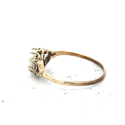 9ct yellow gold opal ring in size P with a vibrant oval opal gemstone, featuring a polished gold band.