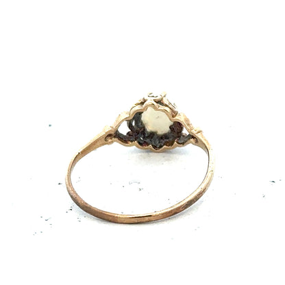 9ct yellow gold opal ring in size P with a vibrant, iridescent opal gemstone, featuring a simple gold band design.