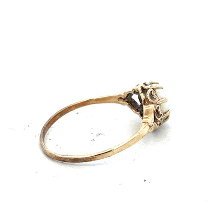 9ct yellow gold opal ring in size P with a vibrant, oval-shaped opal gemstone and a polished gold band.
