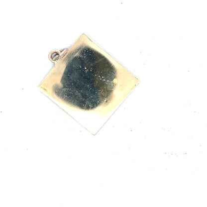 9ct yellow gold pendant weighing 9.6g, unbranded, featuring a detailed design, displayed against a neutral background.
