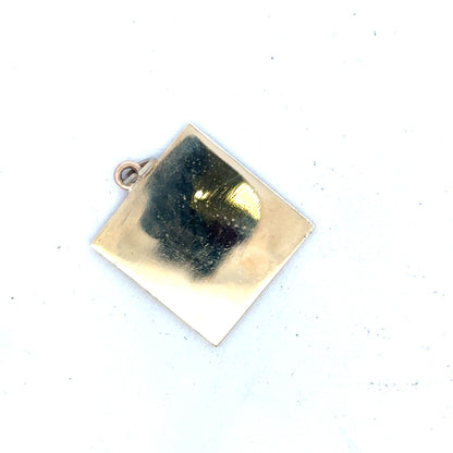 9ct yellow gold pendant weighing 9.6g, showcasing a polished, elegant jewelry piece with a classic design on a plain background.