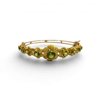 9ct yellow gold peridot bangle featuring a sleek design with vibrant green peridot gemstones, unbranded jewelry accessory