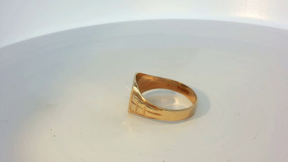 9ct yellow gold ring with a smooth polished finish, showcasing a classic and elegant jewelry design.