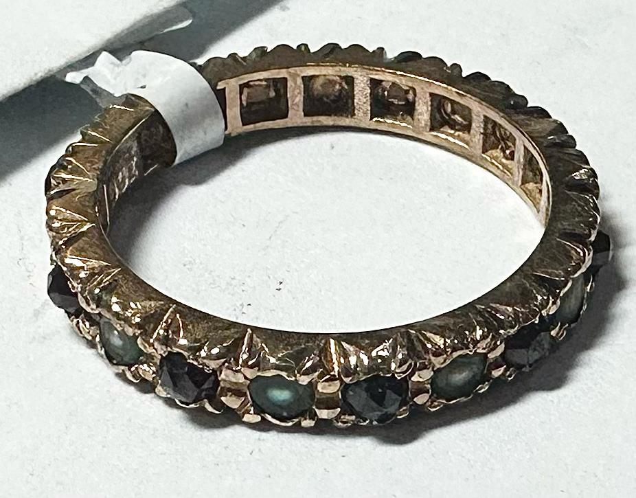 9ct yellow gold ring in size I1/2 with a smooth band, unbranded, shown from a side view.
