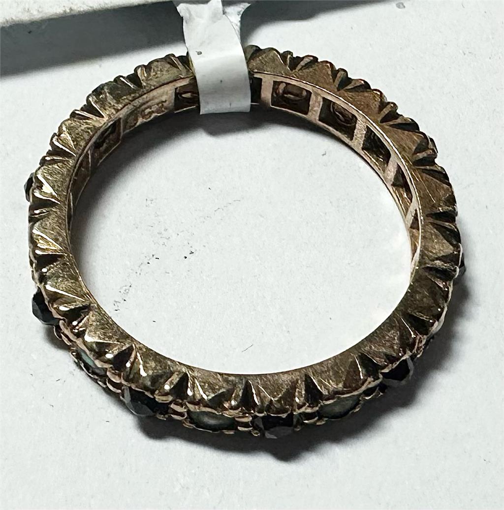 9ct yellow gold ring in size I1/2 with a smooth band, unbranded, showcasing a shiny polished surface.