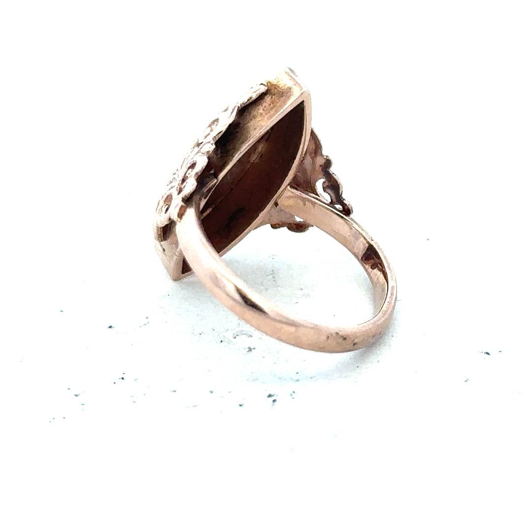 9ct yellow gold ring in size J with a smooth band, unbranded, showcasing a shiny polished finish.