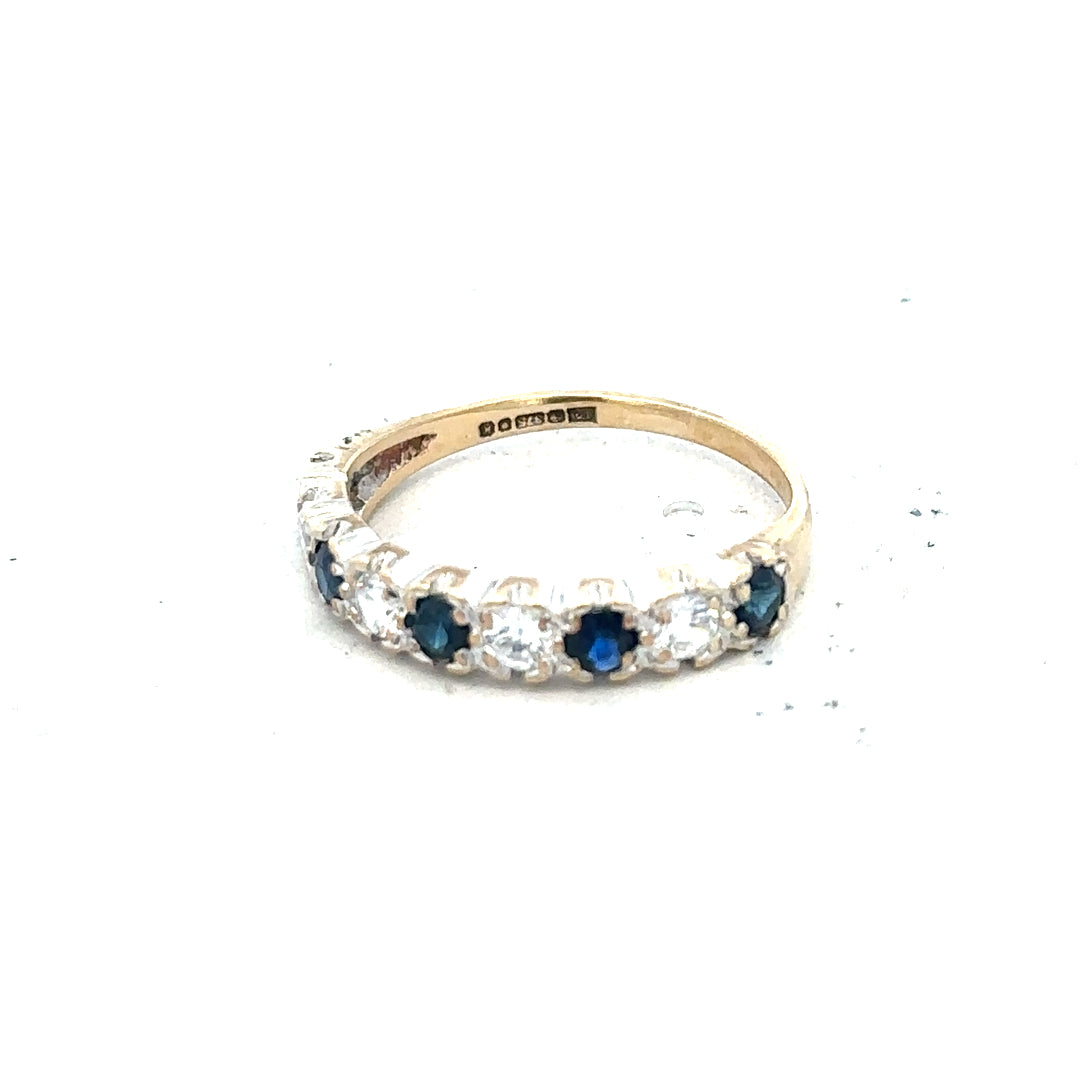 9ct yellow gold ring in size J with a smooth band, unbranded, showcasing a polished finish and elegant design.