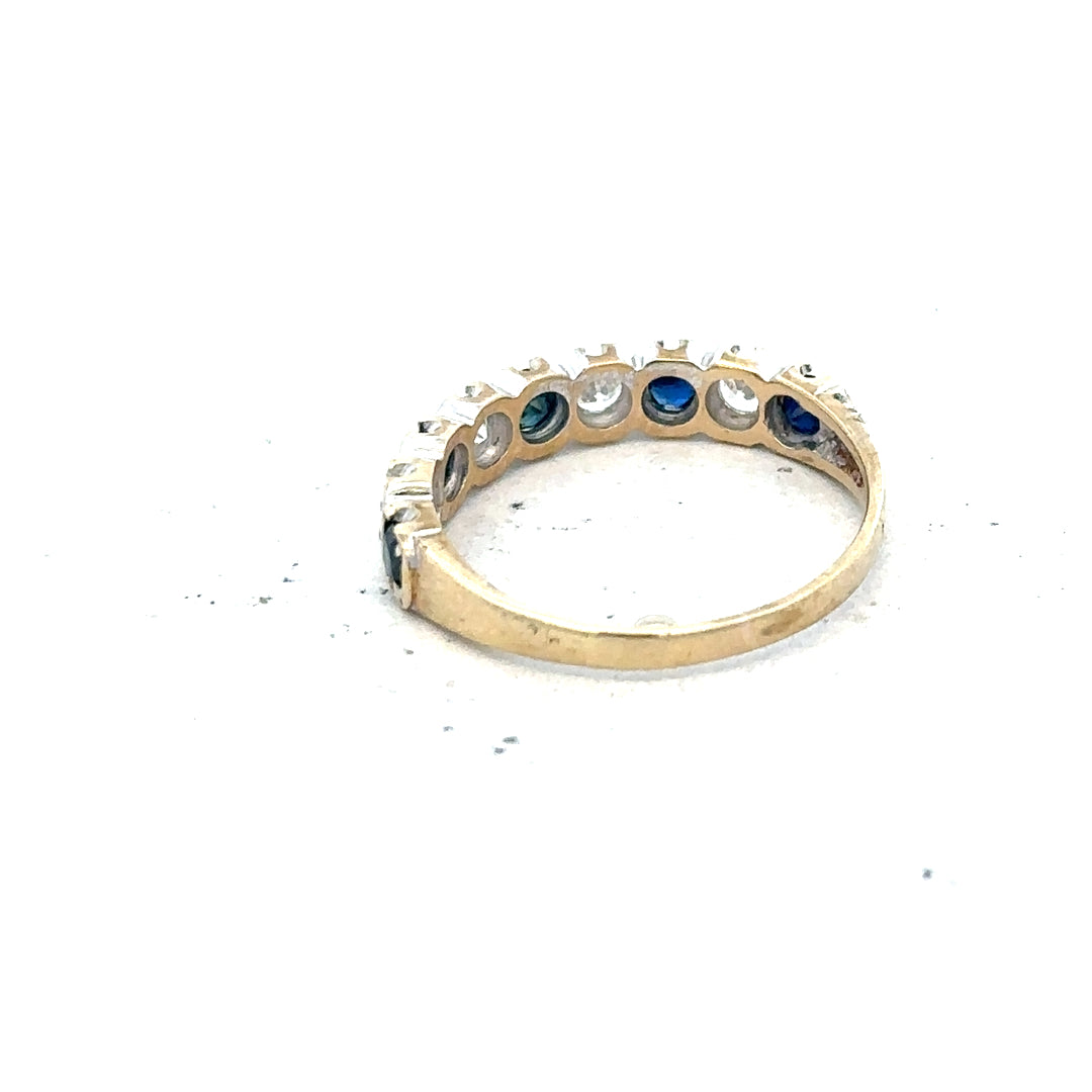 9ct yellow gold ring in size J with a smooth polished finish, unbranded, showcasing its elegant and simple design.