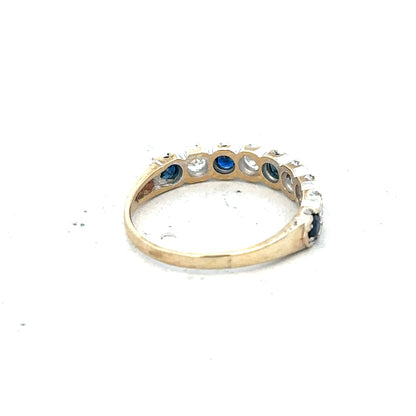 9ct yellow gold ring in size J with a simple, polished band, displayed on a neutral background.