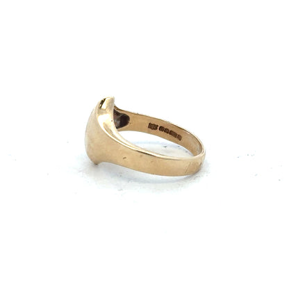 9ct yellow gold ring in size K with a smooth polished band, unbranded jewelry showcasing classic gold craftsmanship.
