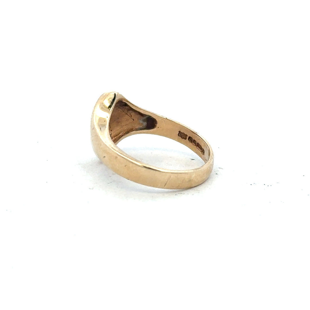 9ct yellow gold ring in size K with a polished smooth band, unbranded jewelry piece.