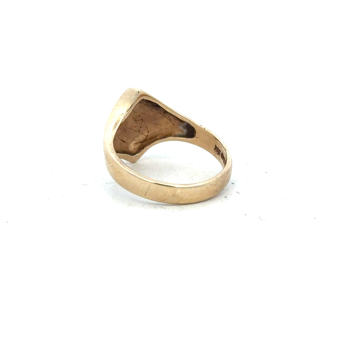 9ct yellow gold ring in size K with smooth band, unbranded jewelry, classic design, shown on a plain background.