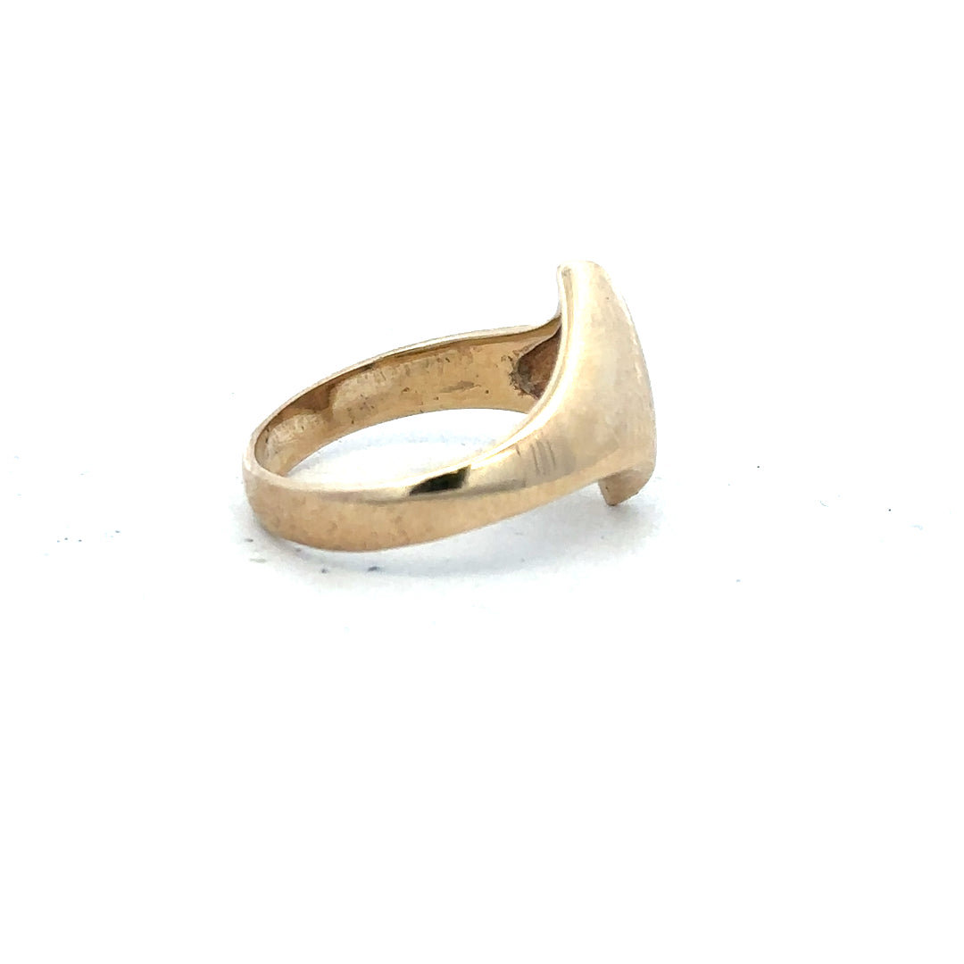 9ct yellow gold ring in size K with a smooth polished band, unbranded jewelry, detailed close-up image.