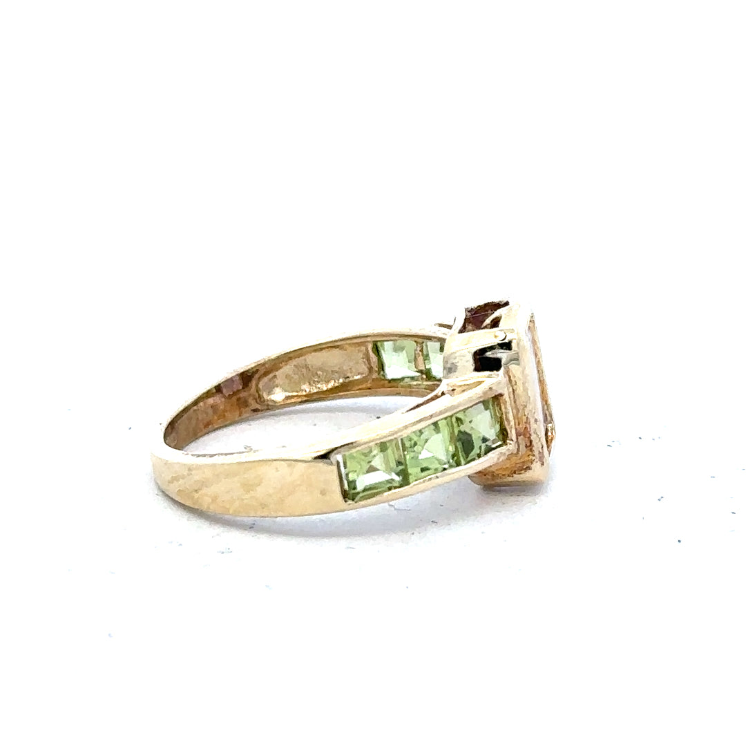 9ct yellow gold ring in size K1/2 with a smooth band, unbranded, shown in close-up on a plain background.