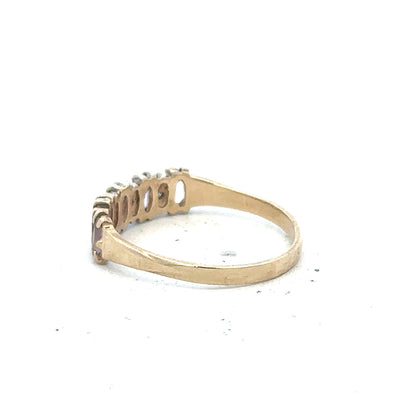 9ct yellow gold ring size K1/2 with a smooth band, unbranded jewelry, shown in a close-up image.