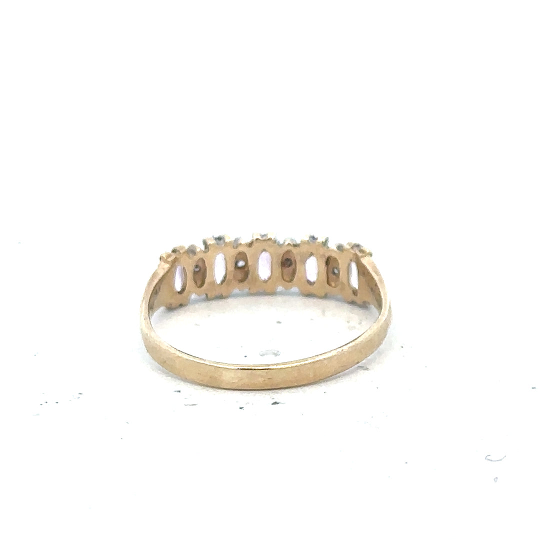 9ct yellow gold ring size K1/2 with a smooth band, unbranded, shown in a close-up image highlighting its polished finish.