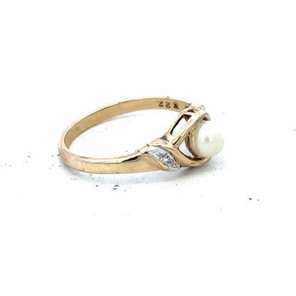 9ct yellow gold ring size K1/2 with a smooth polished band, unbranded jewelry, shown in a close-up image.