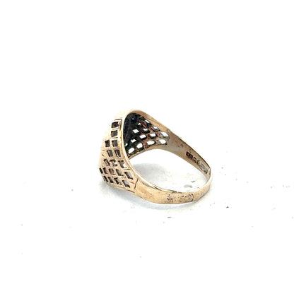 9ct yellow gold ring in size L with a smooth band, unbranded jewelry craftsmanship, shown from a side angle.