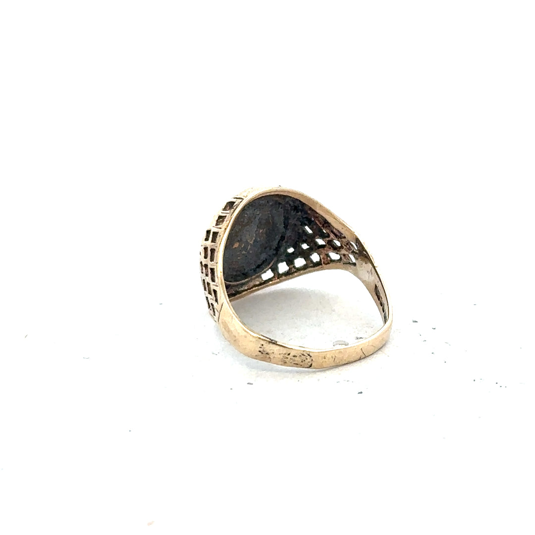 9ct yellow gold ring in size L, displayed on a plain background, showing its simple, elegant band design.