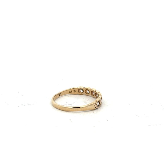 9ct yellow gold ring in size L with a smooth band, unbranded jewelry piece displayed against a neutral background.