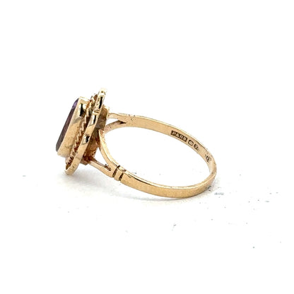 9ct yellow gold ring in size L with a smooth band, unbranded, showcasing a shiny polished finish.