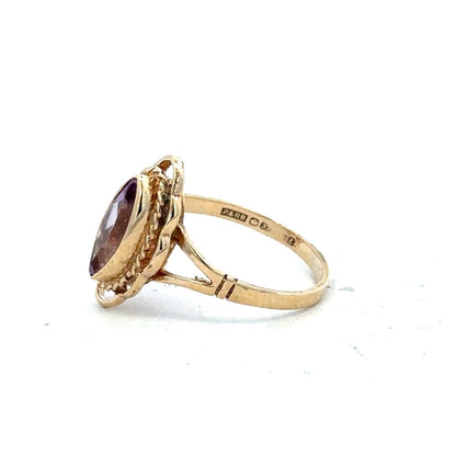 9ct yellow gold ring in size L with a smooth band, unbranded, showcasing a classic and elegant jewelry design.