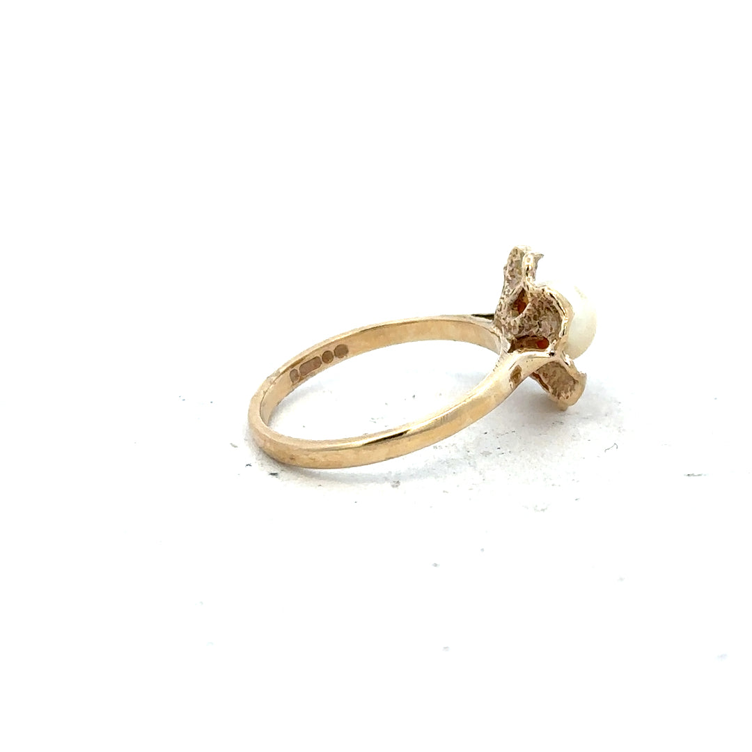9ct yellow gold ring in size L with a simple, polished band, unbranded, shown from a side view.